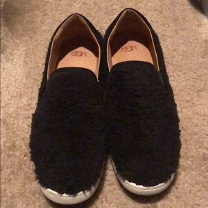 Black fur UGG slip on flats white sole. Worn once!